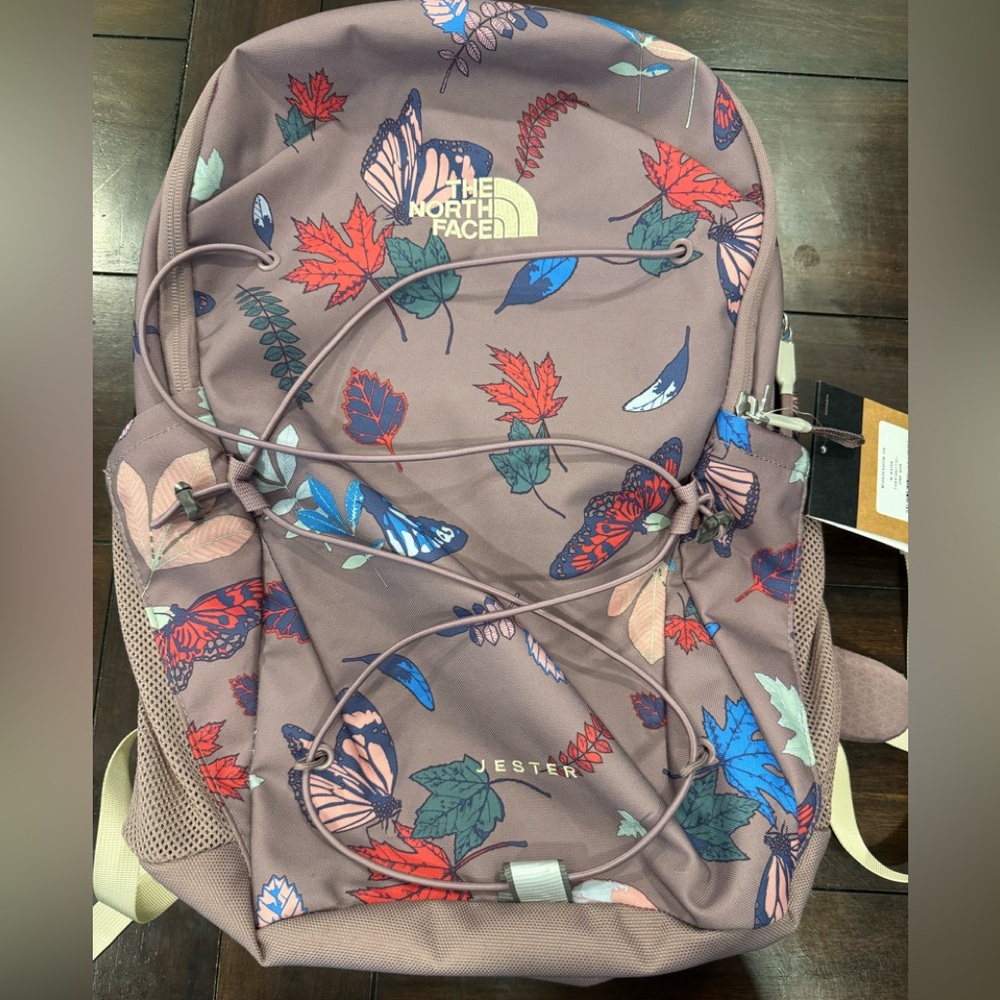 Super cute! The North Face Jester Backpack. Multicolor Leaf and butterfly design